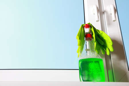Cleaning window using tools - rag and spray detergent  Spring cleaning concept の写真素材