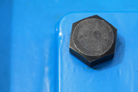 Screws and bolts on blue machine detail of industrial machineryの写真素材