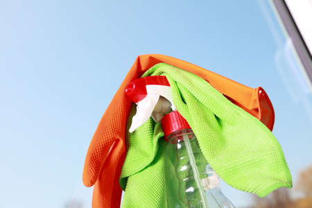 Cleaning window using tools - rag and spray detergent. Spring cleaning concept