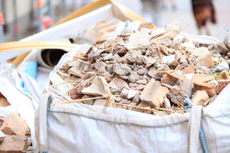 Full construction waste debris bags, garbage bricks and material from demolished houseの写真素材