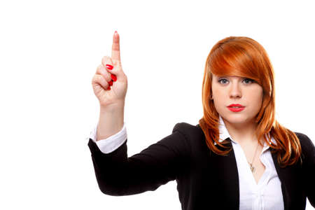 Businesswoman pressing button or something, pointing at the screen. White backgroundの写真素材