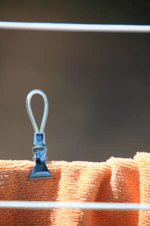 clothes hanging to dry on a laundry line outdoorの写真素材