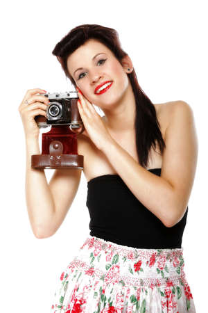 pretty retro summer girl taking picture using vintage camera white backgroundの写真素材