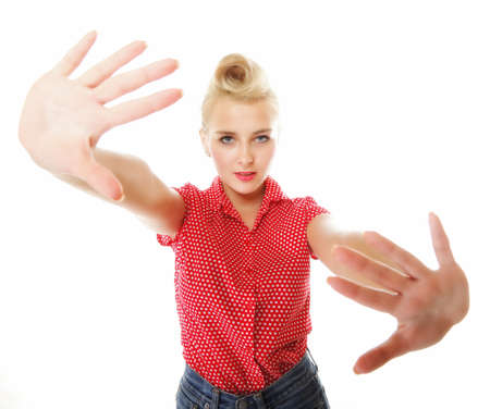 Young woman girl retro style making stop gesture sign isolated on white backgroundの写真素材