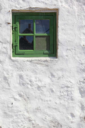 green old window on white wall background architecture detail, scandinaviaの写真素材