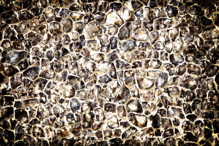 Background of natural stone rock wall texture or cobblestone pavement detailの写真素材
