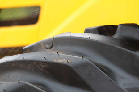 Detailed view of heavy vehicle big wheel of the building dozer or other construction machineryの写真素材