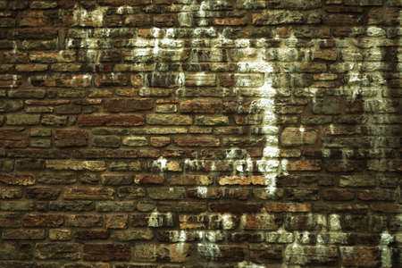 Old brick or stone wall texture grunge brown background