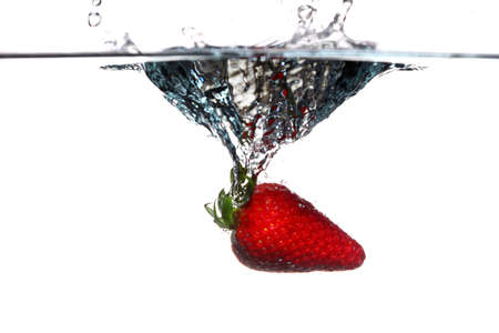 strawberry in the water splash over white background. Healthy food and active life.の写真素材