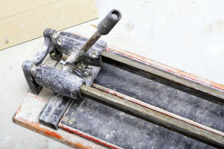Home improvement renovation, close up tool for cutting tiles in construction siteの写真素材