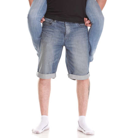 lovers couple with a piggyback ride man and woman legs studio shot isolated on whiteの写真素材