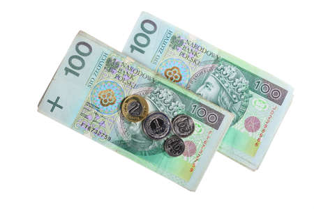 Money and savings concept. Stack of 100's polish zloty banknotes coins currency isolated on white