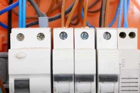 Electrical installation. Close up electrical panel electricity distribution box with wires fuses and...