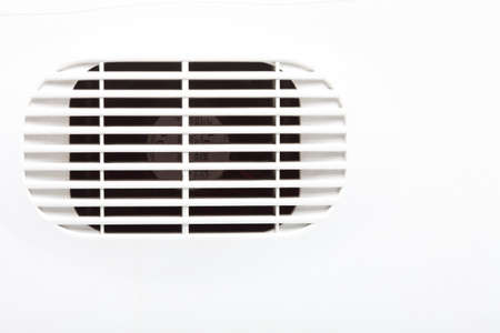 plastic air vent in white wall ventilation grilleの写真素材