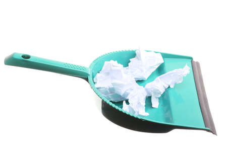 Green dustpan for house work with garbage papers isolated on white. Cleaningの写真素材