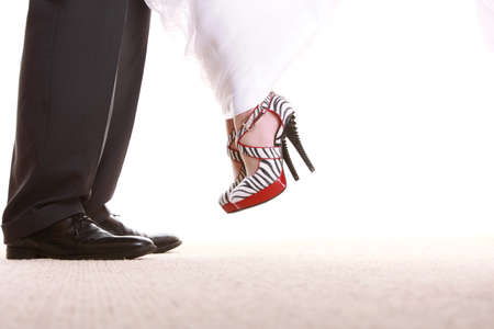 Wedding couple. Legs of the groom and the bride. Feet in footwear shoes indoorの写真素材