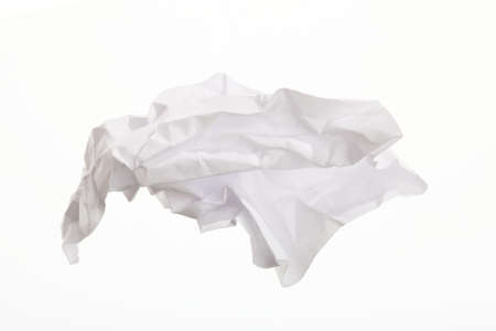 Crumpled paper isolated on white の写真素材