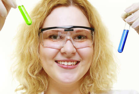 chemist woman or girl student or female laboratory assistant or scientific researcher with chemical glassware test tubes. Experiment, research in progress, isolated on white backgroundの写真素材