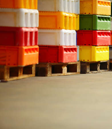 colorful boxes plastic crates. Packing containers piles for fish storage of catch.の写真素材