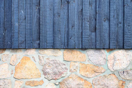 architecture detail stone wall with wooden planks as background