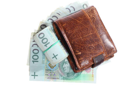 Money and savings concept. Stack and roll of polish zloty one hundred banknotes currency and wallet  isolated on whiteの写真素材