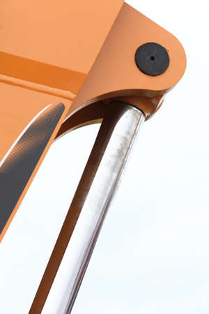 Detail of hydraulic bulldozer excavator arm construction machinery white background