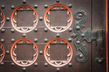 detail part of decorative old wooden church door with ornament