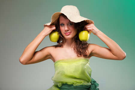 Beautiful spring woman with apple.の写真素材