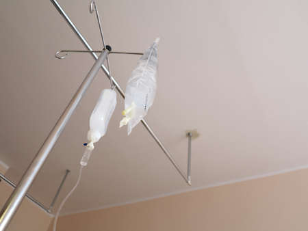 Infusion bottle with IV intravenous solution in hospital