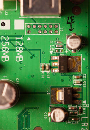 Close-up part of modern equipment. Green electronic circuit as technology concept.