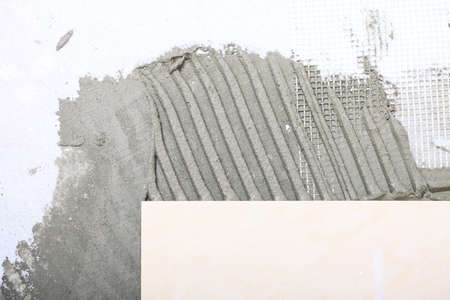 Home improvement, renovation - tiling, ceramic tile floor adhesive, construction siteの写真素材