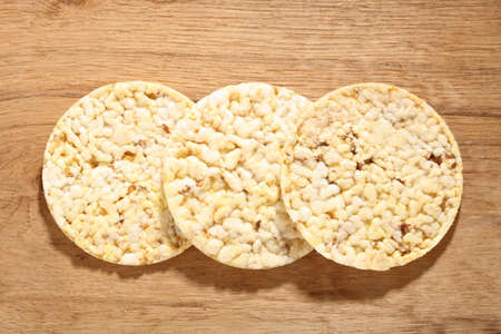 Healthy food nutrition. Thin round corn cakes on wooden background