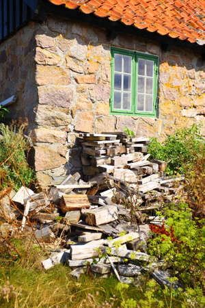stack of chopped firewood at house on Christiansoe island Bornholm in the Baltic Sea Denmark Scandinavia Europeの写真素材