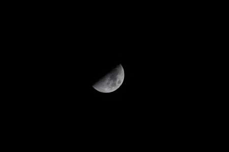 Half moon in clear cloudless dark black sky. Night skyscape. Nature. Astronomy science.の写真素材