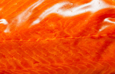 Closeup macro of fresh salmon. Red fish redfish raw meat as food background texture pattern.