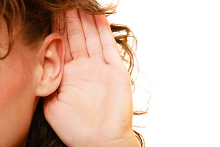 Part of head woman female hand to ear listening isolated on white background. Gossip