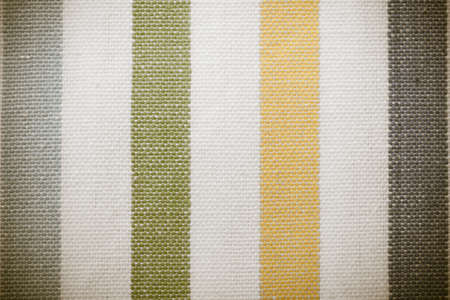 Closeup of colorful green yellow grey gray white striped fabric textile as texture or pattern  Macro...