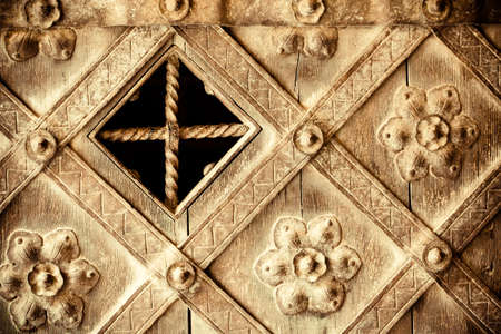 Architectural detail  Part of decorative old wooden door with floral ornament as texture or pattern の写真素材