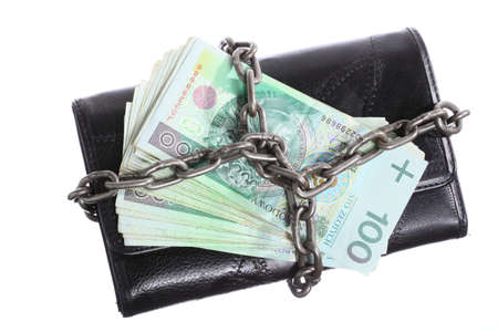 End of personal spending  Female purse polish banknote currency in chain isolated on whiteの写真素材
