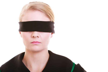 Blind justice  Woman lawyer attorney wearing classic polish  Poland  black green gown covering eyes with blindfold isolated on whiteの写真素材