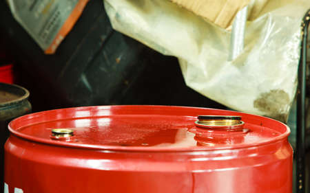 Car servicing  oil change  Red oil barrel canister in mechanic garage auto service or shop  Industry detail の写真素材