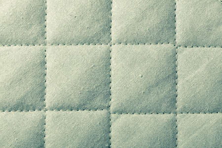 Abstract green soft textured with squares  Quilted textile tiled texture の写真素材