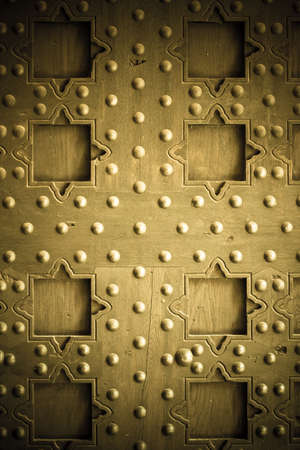 Vintage grunge wooden background door gate of the old castle detail with metal rivetsの写真素材