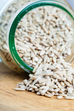 Healthy nutrition diet  sunflower seeds in glass jar on wooden table の写真素材