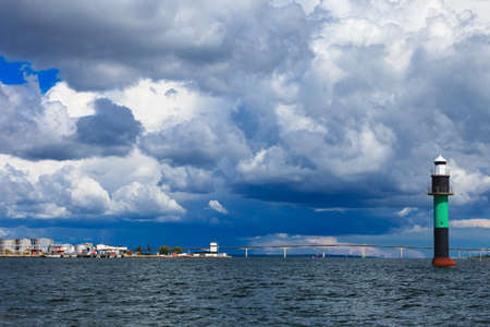 Buoy and Oresundsbron. The Oresund bridge link between Denmark and Sweden in Europe, Baltic Sea. Landmark and travel.の写真素材