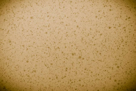 Closeup of beige brown spotted texture as background backdrop pattern, vignetteの写真素材