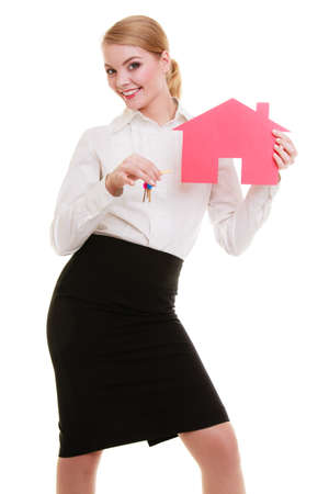 Woman real estate agent holding red paper house and keys  Property business and accomodation or home buying ownership concept,の写真素材