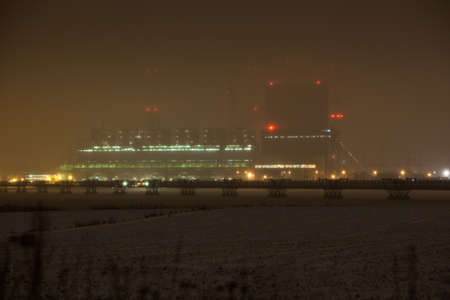 Industry and environment. Winter night scene of power stationの写真素材