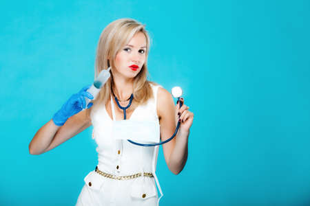 Funny sexy girl doctor nurse with syringe stethoscope. Medical person for health insurance. Vivid...