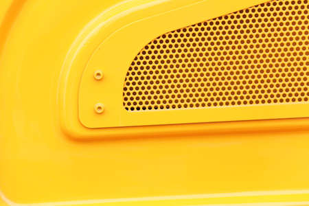 Heavy equipment yellow lattice grid in industry machinery iron plate backgroundの写真素材